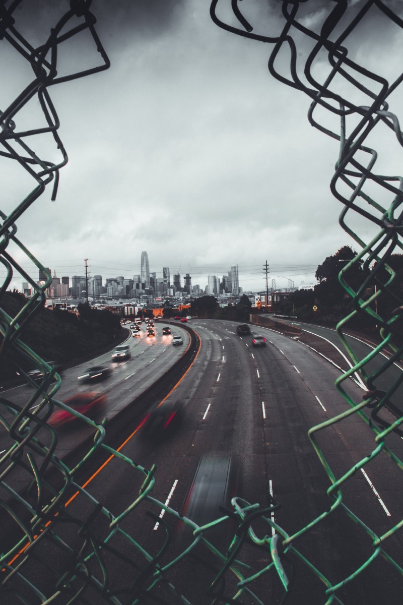 motorway through a hole in the fence