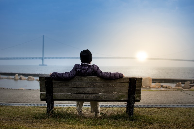 person sitting on bench